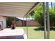 Covered patio features lawn and a backyard brick fireplace at 3942 N 38Th St, Phoenix, AZ 85018