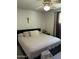 Cozy bedroom with ceiling fan, neutral tones, and a comfortable queen-size bed at 3942 N 38Th St, Phoenix, AZ 85018