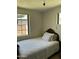 Bedroom featuring a twin bed, neutral tones, and generous natural light from a window at 3942 N 38Th St, Phoenix, AZ 85018