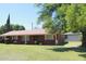 Charming single story brick home with lush green yard and mature trees at 3942 N 38Th St, Phoenix, AZ 85018