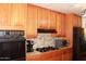 Traditional kitchen with tiled countertops and updated black appliances at 3942 N 38Th St, Phoenix, AZ 85018