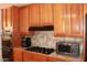 Traditional kitchen with tiled countertops and updated stainless steel appliances at 3942 N 38Th St, Phoenix, AZ 85018