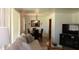 Open-concept living and dining area with hardwood floors, modern lighting, and cozy furnishings at 3942 N 38Th St, Phoenix, AZ 85018