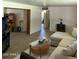 Open-concept living room with neutral colors and wood-look tile flooring at 3942 N 38Th St, Phoenix, AZ 85018