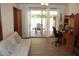 Bright living room with wood floors, sliding glass doors to outdoor patio, and neutral decor at 3942 N 38Th St, Phoenix, AZ 85018