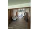 Comfortable bonus room with a futon, ceiling fan, and sliding glass door at 3942 N 38Th St, Phoenix, AZ 85018
