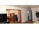 An open-concept living room with light hardwood floors and a view of the adjacent room at 3942 N 38Th St, Phoenix, AZ 85018