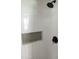 Elegant shower detail with black fixtures and built-in shelving at 3942 N 38Th St, Phoenix, AZ 85018