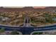 Expansive aerial view of a Primary-planned community with well-manicured landscaping, luxurious homes, and stunning desert scenery at 4050 N Terra Mesa Cir, Mesa, AZ 85207