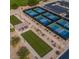 Aerial view of recreational area with pickle ball courts and bowling lawns in a luxury community at 4050 N Terra Mesa Cir, Mesa, AZ 85207