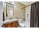 Cozy bathroom features tile flooring, a shower-tub combo, and vanity with sink and mirror at 4050 N Terra Mesa Cir, Mesa, AZ 85207