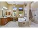 Bathroom with a soaking tub, separate shower, and dual sink vanity, offering a spa-like experience at 4050 N Terra Mesa Cir, Mesa, AZ 85207