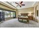 Inviting primary bedroom features a bay window, a ceiling fan, and a luxurious carpeted floor at 4050 N Terra Mesa Cir, Mesa, AZ 85207