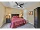 Cozy bedroom featuring a comfortable bed, dark wood furniture, and warm lighting at 4050 N Terra Mesa Cir, Mesa, AZ 85207