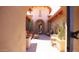 Inviting courtyard with desert landscaping, stylish furniture, and a charming entrance to the home at 4050 N Terra Mesa Cir, Mesa, AZ 85207