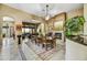 Formal dining room with fireplace, designer rug, and views to other living spaces at 4050 N Terra Mesa Cir, Mesa, AZ 85207