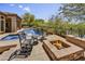 Relaxing pool area features outdoor fire pit, seating, and view of desert landscape at 4050 N Terra Mesa Cir, Mesa, AZ 85207