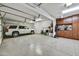 Spacious garage features epoxy flooring, custom cabinets, and plenty of room for parking at 4050 N Terra Mesa Cir, Mesa, AZ 85207