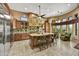 Gourmet kitchen with granite counters, custom cabinets, stainless appliances, and large island at 4050 N Terra Mesa Cir, Mesa, AZ 85207