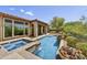 Backyard oasis includes a pool, spa, covered patio, an outdoor grill, and desert landscaping at 4050 N Terra Mesa Cir, Mesa, AZ 85207