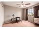 Comfortable bedroom with ample natural light, a ceiling fan, and updated decor at 4062 W Cielo Grande --, Glendale, AZ 85310