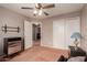 Cozy bedroom featuring carpet floors, ceiling fan, and closet storage space at 4062 W Cielo Grande --, Glendale, AZ 85310