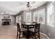 Dining area featuring modern ceiling fan, tile floors and lots of natural light at 4062 W Cielo Grande --, Glendale, AZ 85310
