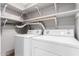 Practical laundry room with appliances and shelving providing storage at 4062 W Cielo Grande --, Glendale, AZ 85310