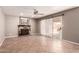 Relaxing living room featuring fireplace, tile floors, and direct access to the backyard at 4062 W Cielo Grande --, Glendale, AZ 85310