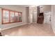 Open living room featuring tile floors, shuttered windows, and stairs leading to the upper level at 4062 W Cielo Grande --, Glendale, AZ 85310