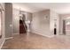 Open-concept living room with tile floors, staircase, and neutral wall color at 4062 W Cielo Grande --, Glendale, AZ 85310