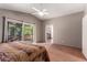 Primary bedroom with sliding glass doors to a private deck and en-suite bath at 4062 W Cielo Grande --, Glendale, AZ 85310