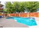 Backyard pool featuring a decorative waterfall and privacy fence at 4062 W Cielo Grande --, Glendale, AZ 85310