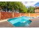 Refreshing backyard pool with a decorative water feature at 4062 W Cielo Grande --, Glendale, AZ 85310