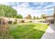 Lush backyard with green lawn and patio area, creating a serene outdoor space at 4110 E Brighton Way, San Tan Valley, AZ 85140