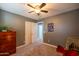 Spare bedroom featuring neutral carpet, ceiling fan, and natural light at 4110 E Brighton Way, San Tan Valley, AZ 85140