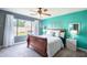 Primary bedroom featuring a ceiling fan, natural light, and neutral carpeting at 4110 E Brighton Way, San Tan Valley, AZ 85140