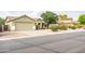 Inviting single-Gathering home with a two car garage, desert landscaping, and well-maintained facade at 4110 E Brighton Way, San Tan Valley, AZ 85140