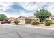 Charming single-story home featuring a three car garage, manicured landscaping, and inviting curb appeal at 4110 E Brighton Way, San Tan Valley, AZ 85140