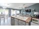 Bright, open-concept kitchen with breakfast bar overlooking the living room and dining area at 4110 E Brighton Way, San Tan Valley, AZ 85140