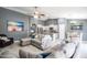 Open concept living area connecting to the kitchen, featuring tile floors and modern decor at 4110 E Brighton Way, San Tan Valley, AZ 85140