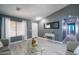 Elegant living room featuring tile floors, a decorative table, and neutral decor at 4110 E Brighton Way, San Tan Valley, AZ 85140