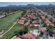 Scenic aerial view of residential neighborhood, golf course, and surrounding mountains at 4116 E Lupine Ave, Phoenix, AZ 85028
