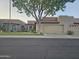 Charming home exterior with a tile roof, desert landscaping, and a two-car garage at 4116 E Lupine Ave, Phoenix, AZ 85028