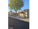 Beautiful single-story home boasts a well-kept lawn, shade tree, and a red tile roof at 4116 E Lupine Ave, Phoenix, AZ 85028