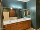 Bathroom featuring double sinks, ample counter space, and decorative lighting at 4130 E Megan St, Gilbert, AZ 85295