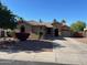 Charming single-story home with a well-maintained yard, a spacious driveway, and a sidewalk at 4130 E Megan St, Gilbert, AZ 85295