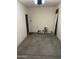 Clean, empty garage featuring newly painted walls, great for storage or a workshop at 4130 E Megan St, Gilbert, AZ 85295