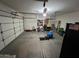 Spacious two car garage featuring ample storage and a clean concrete floor at 4130 E Megan St, Gilbert, AZ 85295