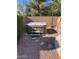 Backyard hot tub situated on a gravel area with desert landscaping and privacy wall at 4130 E Megan St, Gilbert, AZ 85295